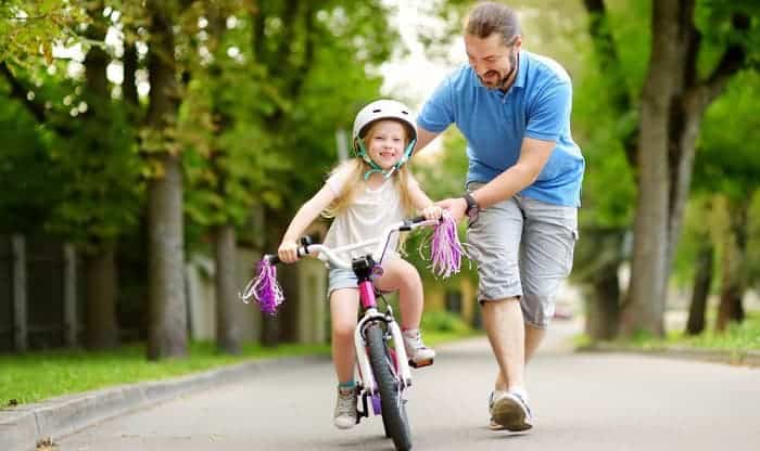 Teaching child to ride without training on sale wheels